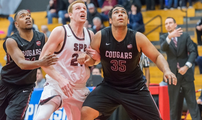 Mitch Penner of SPU battles on the boards in the NCAA West Regional vs. Azusa Pacific.